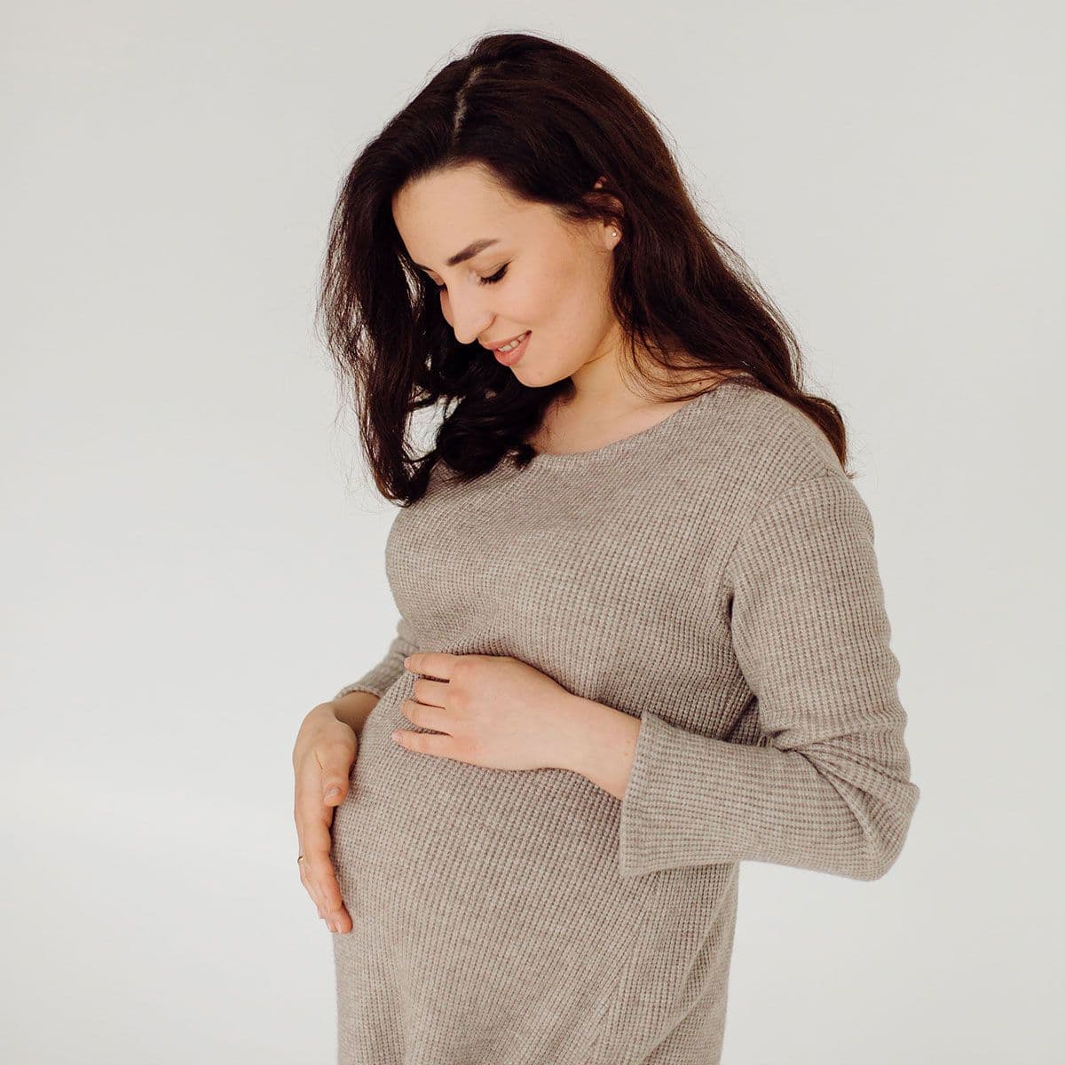 beautiful-young-pregnant-woman-posing-studio-dress-resized